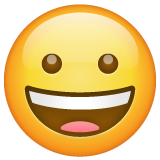 How Grinning Face emoji looks on Whatsapp.