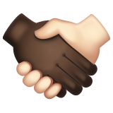 How Handshake: Dark Skin Tone, Light Skin Tone emoji looks on Whatsapp.