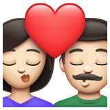 Bagaimana emoji Cium: perempuan, lelaki dan ton kulit cerah kelihatan di Whatsapp.