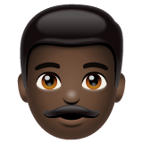 Bagaimana Man: Dark Skin Tone emoji terlihat di Whatsapp.