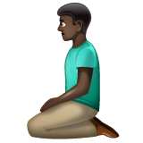 Bagaimana Man Kneeling: Dark Skin Tone emoji terlihat di Whatsapp.