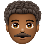 How Man: Medium-Dark Skin Tone, Curly Hair emoji looks on Whatsapp.