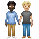 How People Holding Hands: Dark Skin Tone, Medium-Light Skin Tone emoji looks on Whatsapp.