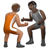 A quoi ressemblent les emoji Personnes faisant de la lutte : peau légèrement mate et peau foncée sur Whatsapp.